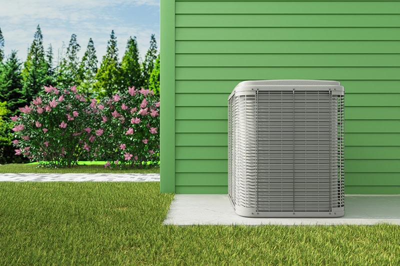 air conditioner installed outside of a home.