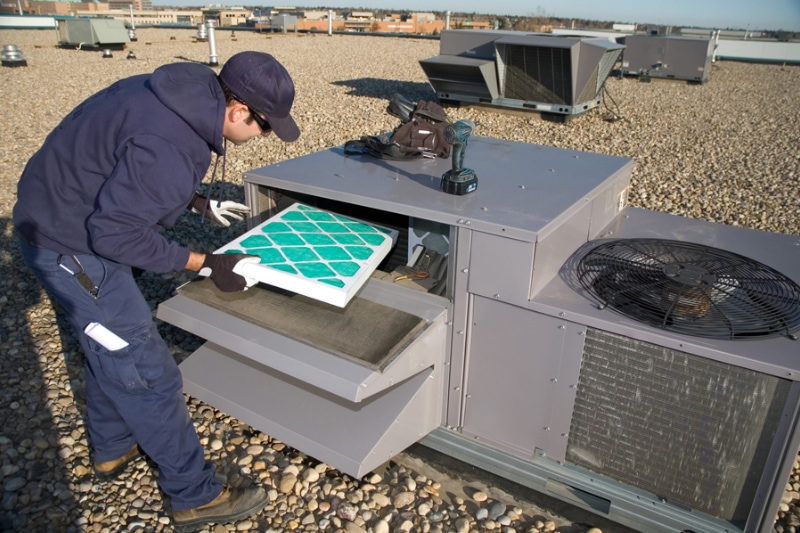 Commercial HVAC maintenance being performed on a rooftop unit in Boone, NC. Scott Brothers blog image.