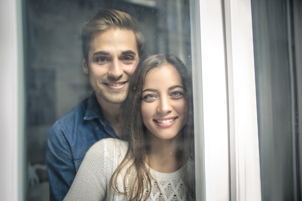 furnace pressure switches, smiling couple looking out the window