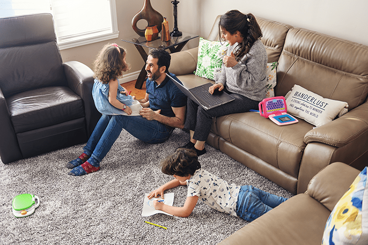 A family relaxes in a living room.  What Indoor Air Quality Accessories Can Help Keep Me Healthy?